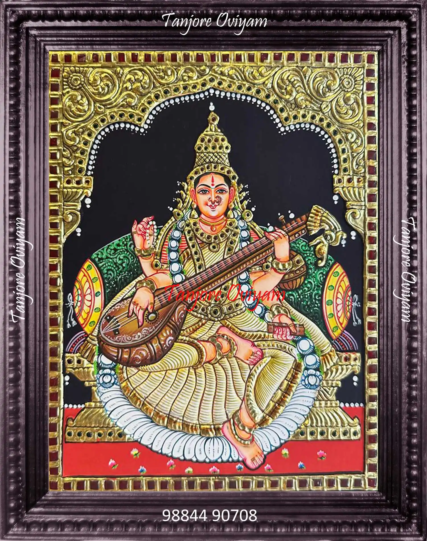 Handmade Saraswathi Tanjore painting with veena, gold foil detailing and traditional archwork